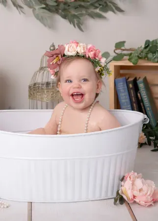 Baby enjoying a cake smash.